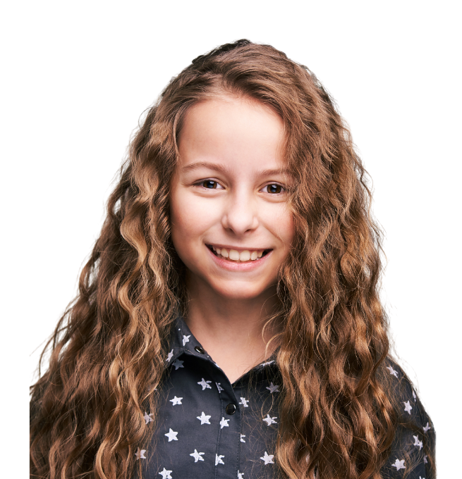 Smiling child with healthy hair after lice treatment in Sharjah